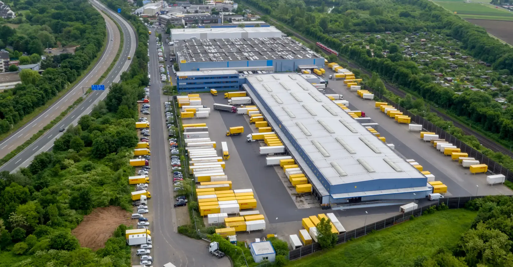 Nighttime view of an illuminated mixed-use campus developed by Prime Property Development